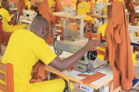prisoner working on sewing maching